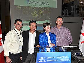 Kellie Leitch, Government of Canada representative poses with AGNORA founders in announcement to invest in the glass company.