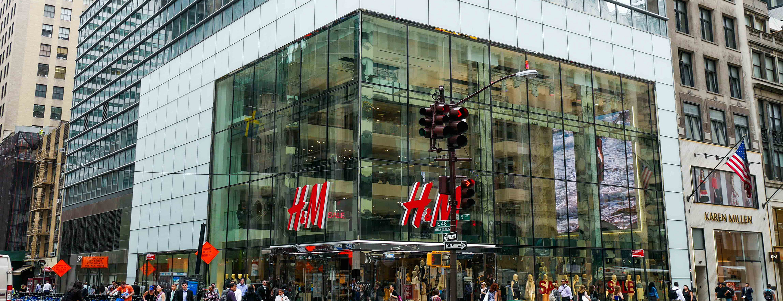 Across the street, corner view of H&M flagship store on 5th ave. Highlights the oversize laminated and insulated glass units.