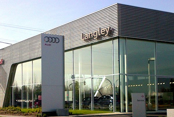 Exterior shot of Audi dealership featuring oversized, insulated glass units combining low-e and clear glass.