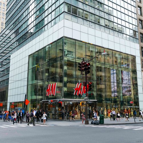 Across the street, corner view of H&M flagship store on 5th ave. Highlights the oversize laminated and insulated glass units.