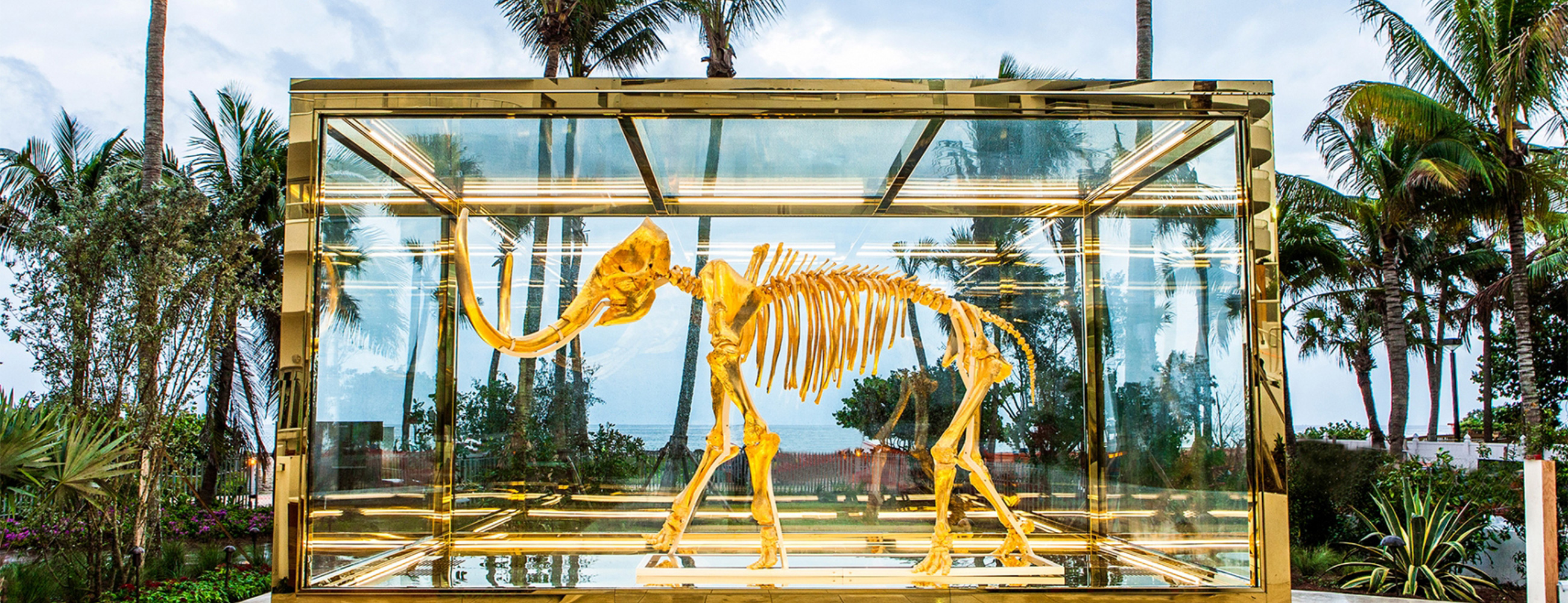 Gilded woolly mammoth encased in oversize insulated glass units