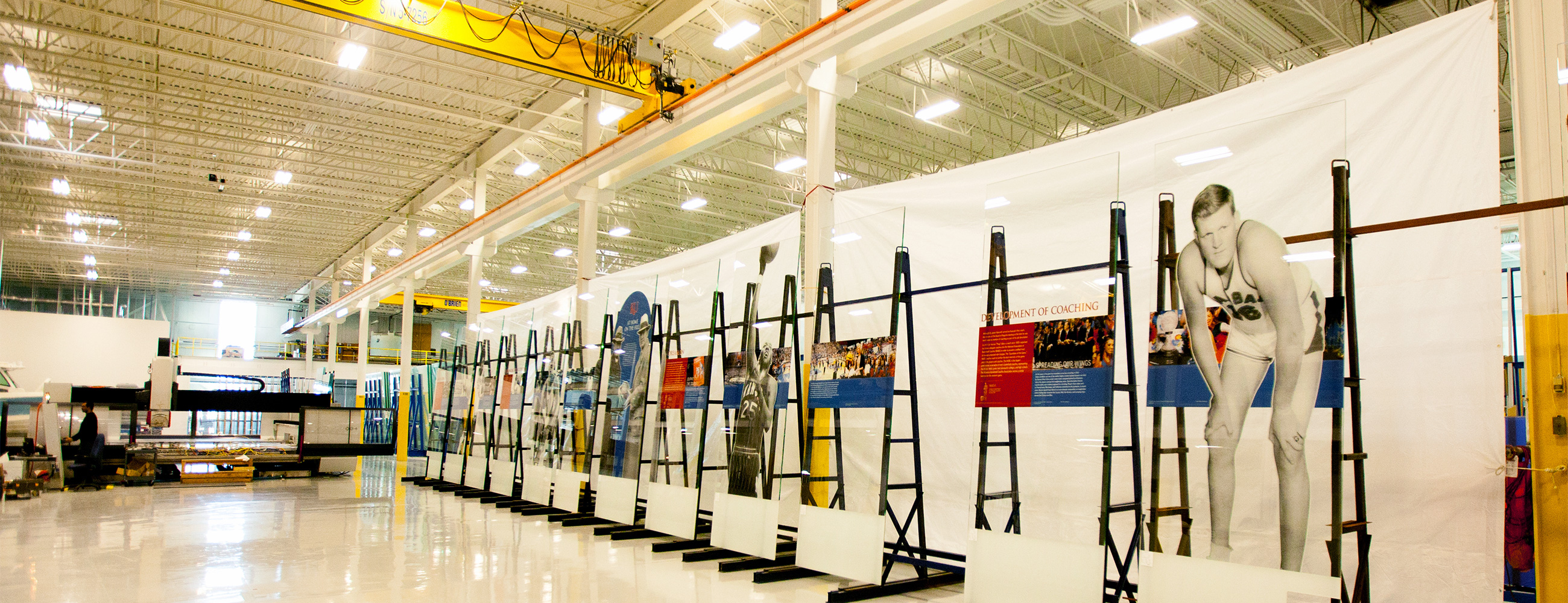 View of the digitally-printed images of the history of basketball on glass mural, inside the AGNORA plant.