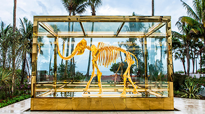 Gilded woolly mammoth encased in oversize insulated glass units