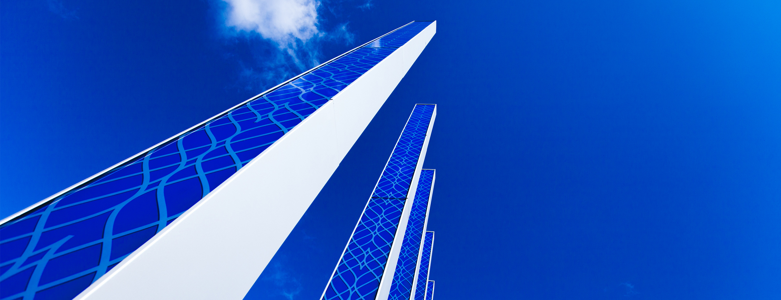 AGNORA digitally printed ceramic frit 12m tall gateway pylons, fabricating both monolithic and laminated tempered glass for the Cadillac Fairview Shops at Don Mills.