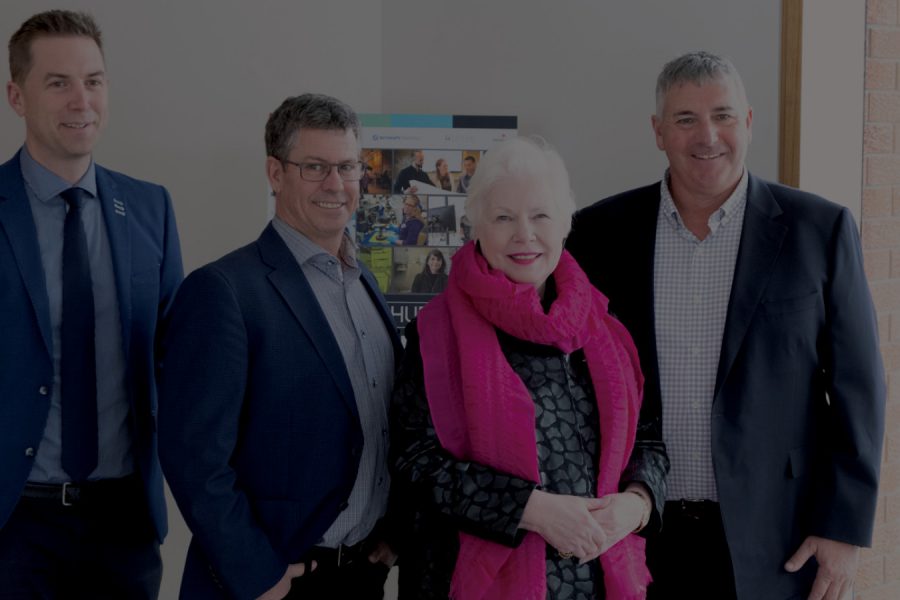 The Honourable Elizabeth Dowdswell and AGNORAs leadership team stand in the foyer of Agnora's Collingwood manufacturing facility